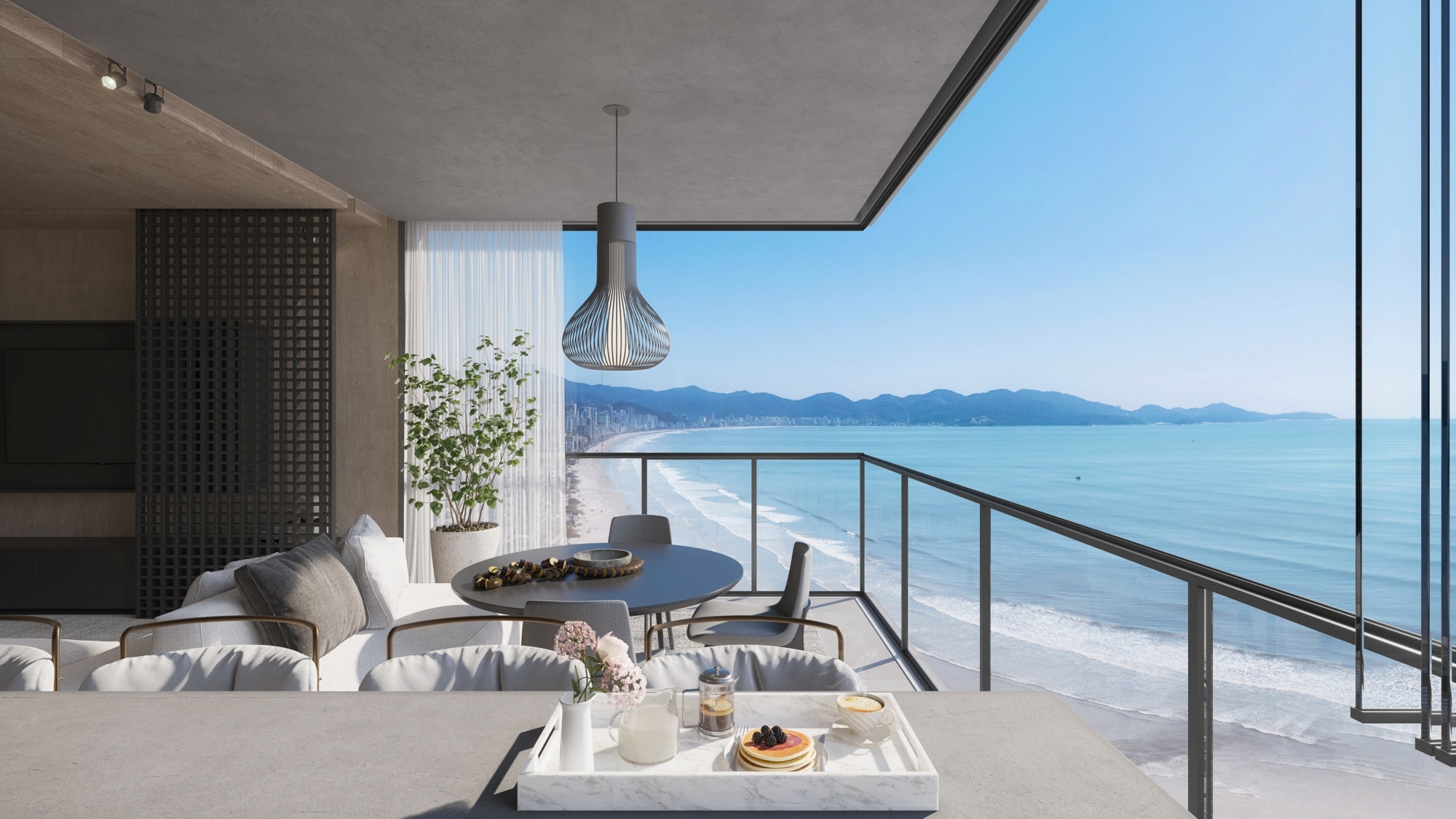 Lujosa sala de estar con hermosos muebles planificados y diseñados para disfrutar la vista al mar y su entorno